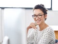 Make creativity a job. a young office worker sitting at her workstation in an office. Royalty Free Stock Photo