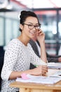 Make creativity a job. a young office worker sitting at her workstation in an office. Royalty Free Stock Photo