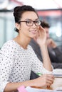 Make creativity a job. a young office worker sitting at her workstation in an office. Royalty Free Stock Photo