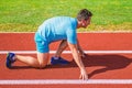 Make effort for victory. Runner ready to go. Adult runner prepare race at stadium. How to start running. Sport tips from