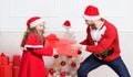 Make it fun. Kid cute girl play with father near christmas tree. Playful daughter and dad celebrate christmas. Winter Royalty Free Stock Photo