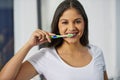 Make it a good habit, brush twice a day. an attractive young woman getting ready in her bathroom. Royalty Free Stock Photo