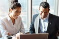 They make a great team. two young businesspeople working together in a modern office. Royalty Free Stock Photo