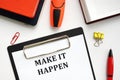 MAKE IT HAPPEN sign on the piece of paper Royalty Free Stock Photo