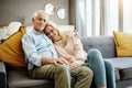 Make home a place of happiness. a happy mature couple relaxing on the sofa at home. Royalty Free Stock Photo