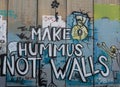 Make hummus not walls on the wall in Bethlehem, Palestine made by Bansky.