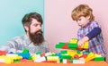 Make with inspiration. building plane with colorful constructor. love. child development. small boy with dad playing Royalty Free Stock Photo