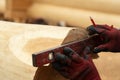Build a house from logs. Preparation of logs for the assembly of the structure. Assembly of a wooden log house at a Royalty Free Stock Photo