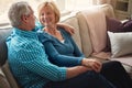 Make love a part of home. a happy mature couple relaxing on the sofa together at home. Royalty Free Stock Photo