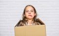 Make moving easier. Girl small child carry cardboard box. Move out concept. Prepare for moving. Rent house. Real estate