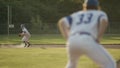 Make the play! Shortstop making a play to first as a running comes in.