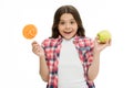 Make right choice. Can sugar sweet taste make us happy. Girl holds sweet lollipop and apple. School lunch alternative Royalty Free Stock Photo