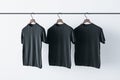 Make a sign concept with three blank black t-shirts Royalty Free Stock Photo