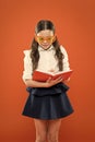 Make some notes. writing in workbook. children literature. get information from book. happy school girl in uniform and Royalty Free Stock Photo