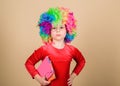 Make studying fun. Truly happy childhood. Girl cute playful child wear curly rainbow wig. Life is fun. Happy little