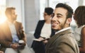 Make sure to choose something you love. Portrait of a business man sitting in a meeting with his colleagues. Royalty Free Stock Photo