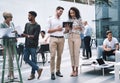 Make them laugh and youll make a lasting impression. a young businessman and businesswoman using a digital tablet at a Royalty Free Stock Photo