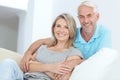 We make time to relax together at home. Portrait of a happy mature couple relaxing at home. Royalty Free Stock Photo