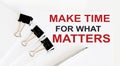 MAKE TIME FOR WHAT MATTERS written on a white page with office tools