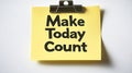 Make Today Count, Motivational Message on a Yellow Sticky Note Clipped to a White Background Royalty Free Stock Photo