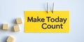 Make Today Count Yellow Sticky Note with Motivational Text and Wooden Cubes on White Background Royalty Free Stock Photo