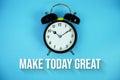 Make Today Great text and alarm clock on blue background Royalty Free Stock Photo