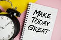 Make Today Great text written on notepad with alarm clock on pink background Royalty Free Stock Photo
