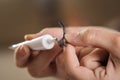 Make up artist adding glue on artificial eyelashes