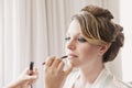 Make up artist applying lipstick Royalty Free Stock Photo