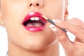 Make-up artist applying lipstick on mouth Royalty Free Stock Photo