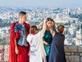 The make-up artist makes makeup for the model before shooting at Mt. Scopus in Jerusalem in Israel