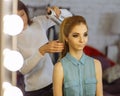 Make-up artist preparing model in a dressing room before photosession Royalty Free Stock Photo