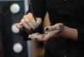 Make-up artistÃ¢â¬â¢s hand taking eyeshadow from palette with a brush Royalty Free Stock Photo