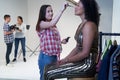 Make Up Artist Working On Fashion Shoot In Photographers Studio Royalty Free Stock Photo