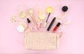 Make up bag and set of professional decorative cosmetics, makeup tools and accessory on pink background. beauty, fashion Royalty Free Stock Photo