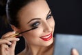 Make-up. Beautiful Woman Doing Makeup. Mascara Brush. Red Lips Royalty Free Stock Photo