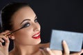 Make-up. Beautiful Woman Doing Makeup. Mascara Brush. Red Lips Royalty Free Stock Photo