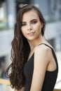 Make up beauty. Close up portrait young brunette woman in black dress Royalty Free Stock Photo