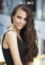 Make up beauty. Close up portrait young brunette woman in black dress Royalty Free Stock Photo