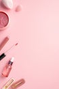 Make up beauty concept. Top view vertical photo of beauty blenders pink eye patches lip gloss glass dropper bottle and two stylish Royalty Free Stock Photo