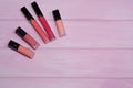 Make up beauty products on pink background. Set of red and pink lipsticks. Decorative cosmetics. Top view, flatlay. Copyplace Royalty Free Stock Photo
