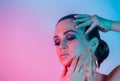 Make up and Beauty Woman under the neon pink and blue light Royalty Free Stock Photo