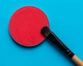 For Make-up. Bright shade with brush on a blue background Royalty Free Stock Photo