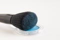 Make-up brush with blue eyeshadows Royalty Free Stock Photo