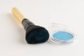 Make-up brush with blue eyeshadows Royalty Free Stock Photo