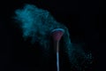 Make-up brush with blue powder explosion isolated on a black background Royalty Free Stock Photo