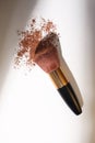 Make up brush and brown powder isolated on white background with copy space for your text Royalty Free Stock Photo