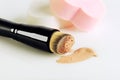 make-up brush, sponges and smear makeup base on a white background, copyspace, horizontal