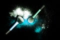 Make-up brush with white powder spilled glitter dust on black background. Makeup brush on new year`s Party with bright colors. Royalty Free Stock Photo