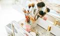 Make-up brushes and cosmetic on dressing table Royalty Free Stock Photo